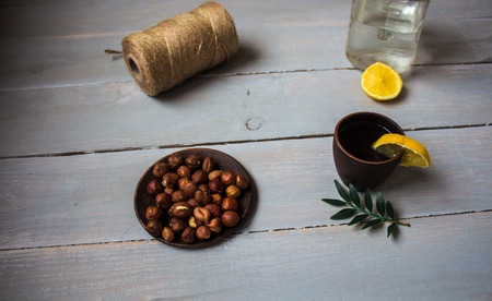 alcoholic drink with lemon on wooden backgroundの写真素材