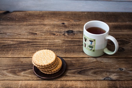 a cookies and tea on wooden backgroundの写真素材