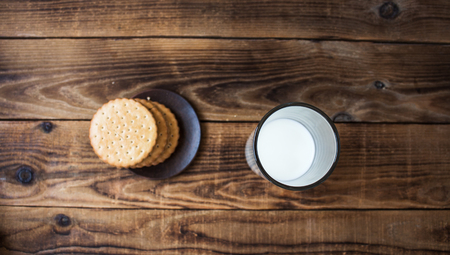 cookies and milk on wooden backgroundの写真素材