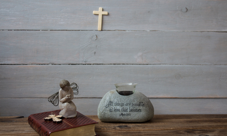 a angel bible and cross on wooden backgroundの写真素材