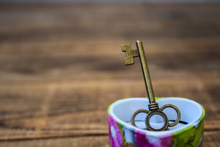 key in a giftbox on wooden backgroundの写真素材