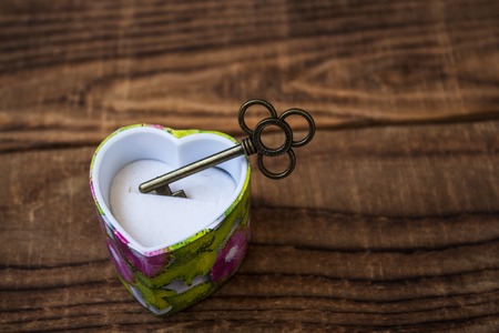 key in a giftbox on wooden backgroundの写真素材
