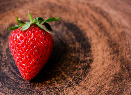 ripe juicy red strawberry on a plateの写真素材