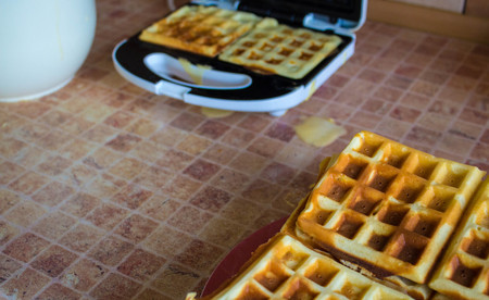 a stack Belgian waffles on a plateの写真素材