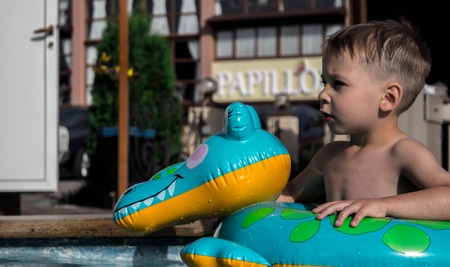 a little boy in the poolの写真素材