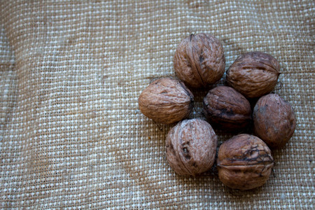walnuts in the background of burlapの写真素材