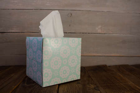 box with napkins on wooden backgroundの写真素材