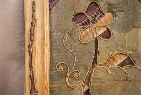 handmade photo album with flower on wooden backgroundの写真素材