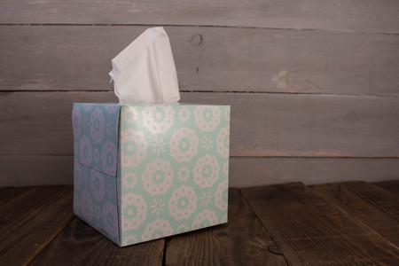 box with napkins on wooden backgroundの写真素材