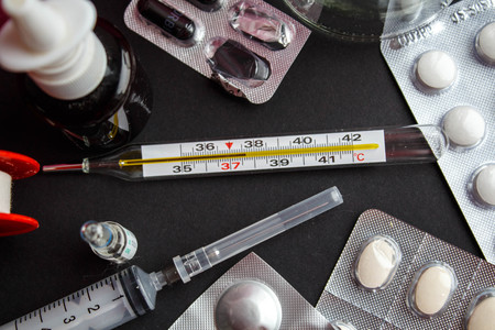 different medicines for treatment on black background