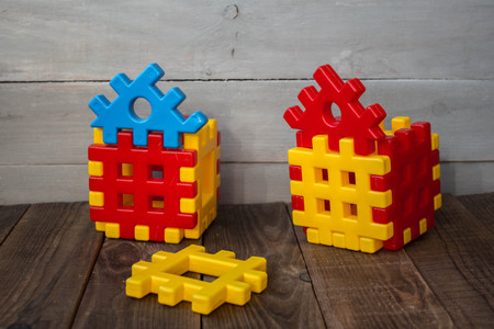 a childrens designer yellow and red on wooden background