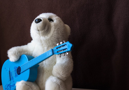 a polar bear with guitar on black backgroundの写真素材