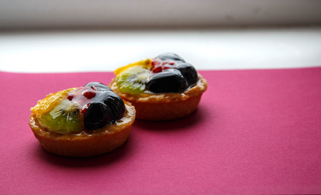 a tasty cake with fresh fruits and berriesの写真素材