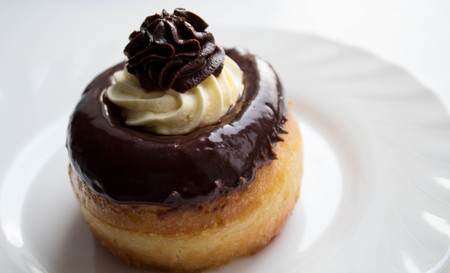 a delicious rum cake with chocolate and butter cream on a plateの写真素材