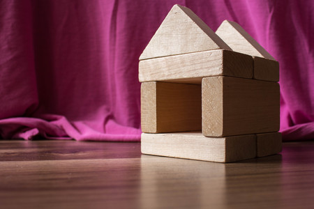 wooden house with a children's designer on the floorの写真素材