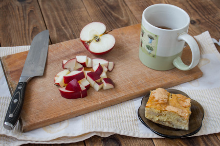 apple pie knife and tea on a wooden backgroundの写真素材