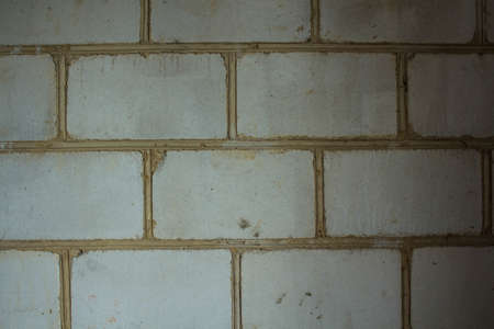 the old wall with white brick stone backgroundの写真素材