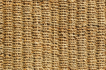  wicker basket with original pattern, straw backgroundの写真素材