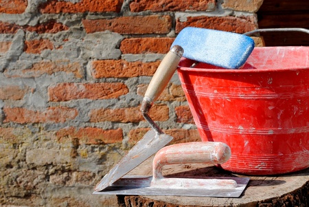 trowel, spatula and bucket, bricklayer toolsの写真素材