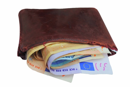 Euro bills in a brown wallet isolated on white backgroundの写真素材