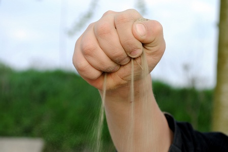 sand falls down from a kid hand