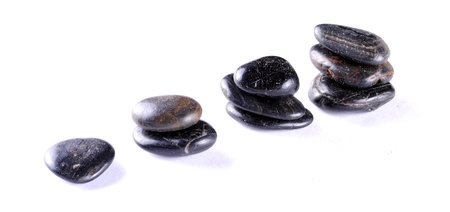 black zen stones on white backgroundt, soft shadowsの写真素材