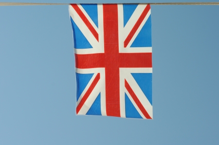 United Kingdom flag waves in a blue skyの写真素材