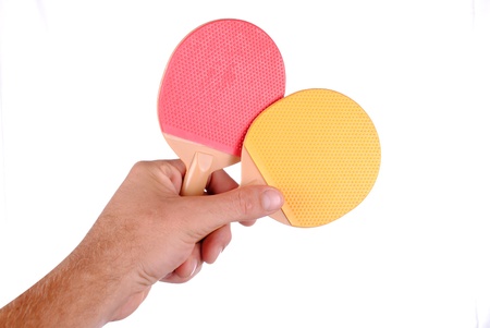 hand holds two table tennis rackets, isolated on white