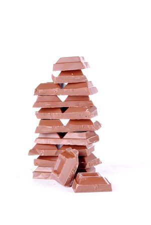 stack of chocolate pieces isolated on white backgroundの写真素材
