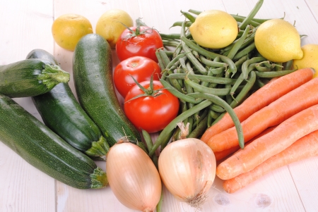 fresh organic vegetables on a wooden tableの写真素材