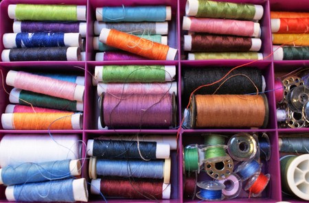 Different colors of yarn in a sewing box