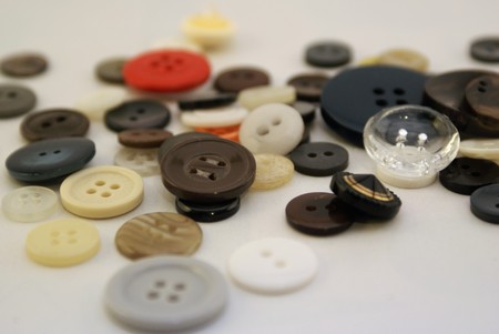 Pill or used buttons close-up