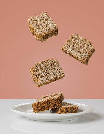 slices of wholemeal bread floating in the air. Light food concept and healthy eating.の写真素材