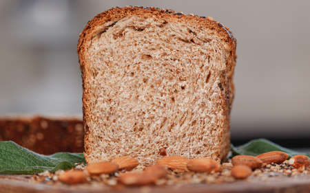 Black rye bread cut in the middle. Baking from rye and flour. Front viewの写真素材