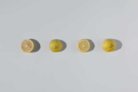 Close-up top view fresh slice lemon fruit on white background. Pattern. Set of multiple images. Part...