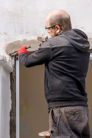 A Caucasian Latin American bricklayer. Worker drinking mate, while pausing to rest. Hispanic-Latin...