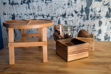 a wooden table on it a wooden box and a stand photo on the sideの写真素材