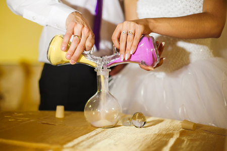 Wedding ceremony of mixing sands in new familyの写真素材