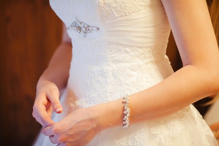 Elegant Bridal White Dress and Young Female Handsの写真素材