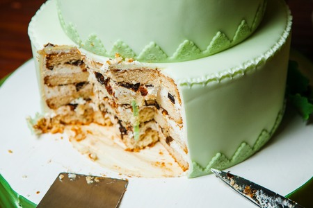 Wedding Pie with Cut Piece and Knife near Cutlery