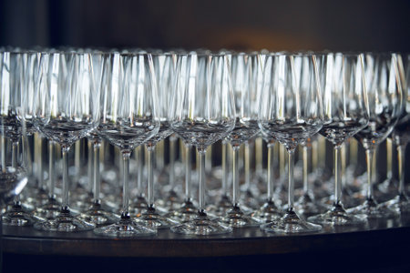 Lots of empty wine glasses on the bar, close up. Restaurant serving.の写真素材