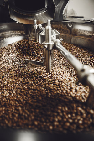 Freshly roasted coffee in cooling drum, vertical close-up.の写真素材
