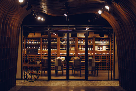 Wine room in shop cellar. Bottles of various wines lie beautifully on the counter.