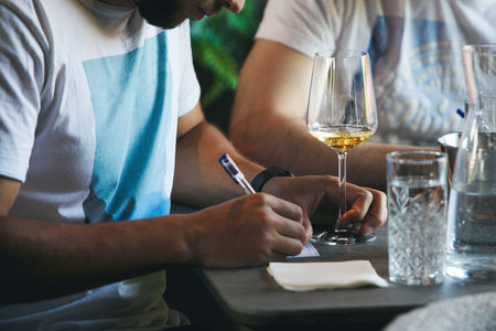 Sommelier school. Professional wine waiters are trained, close up. Winemaking courses, wine tasting.の写真素材