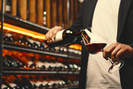 Red Wine Stream Mid-Pour in Wine Cellar