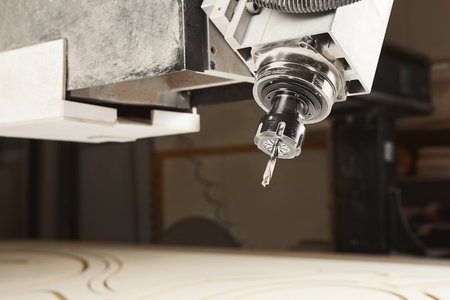 Cutting wood using a machine with numerical control. Cnc tool.の写真素材