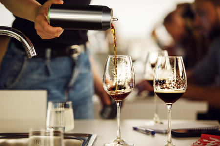 Close up Photo of Pouring Stout Beer from Can to the Glassesの写真素材