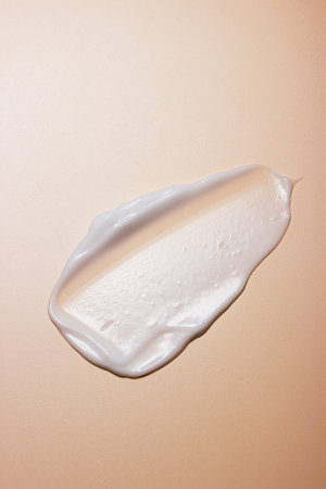 Textured White Lotion Swipe on Satin Beige