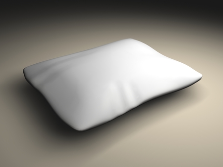 white pillow on the pale brown surfaceの写真素材
