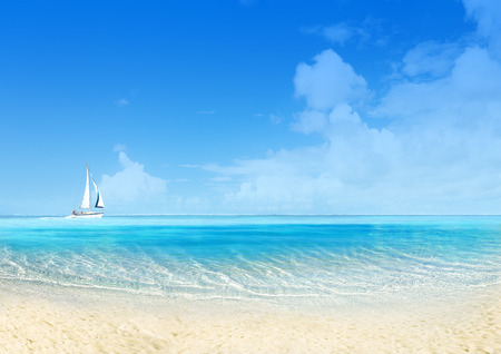 Marine landscape with sailing boat, white sand beach and blue sky. Tranquil sceneの写真素材